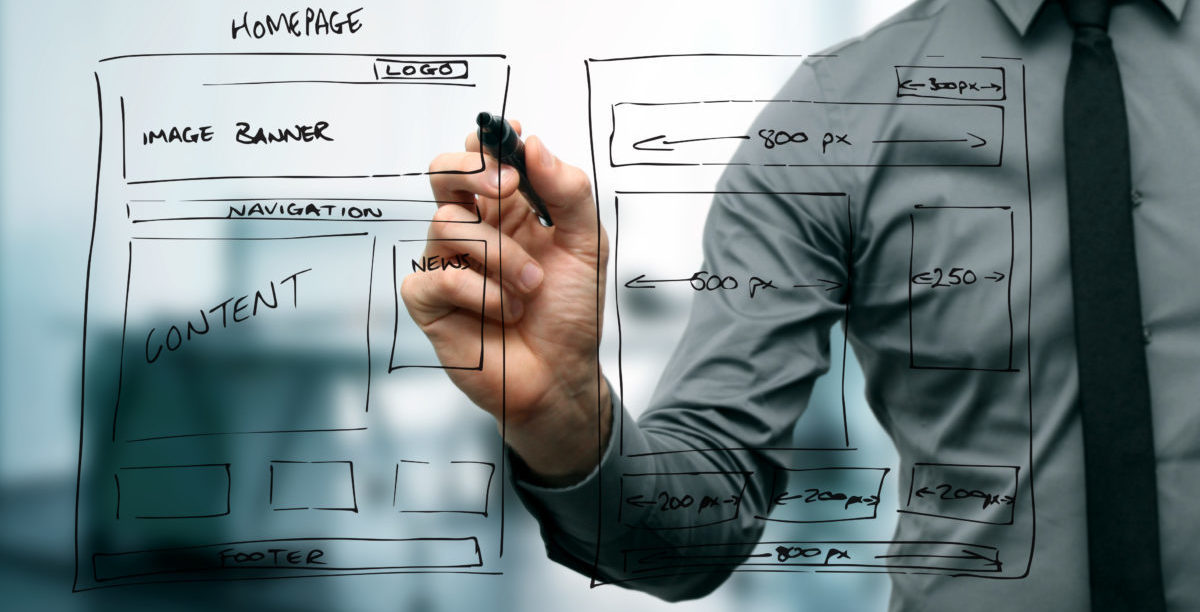 designer drawing website development wireframe